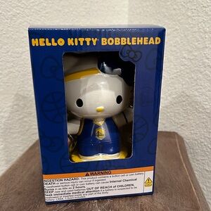 Hello Kitty Bobblehead in the uniform colors of the Golden State Warriors NBA